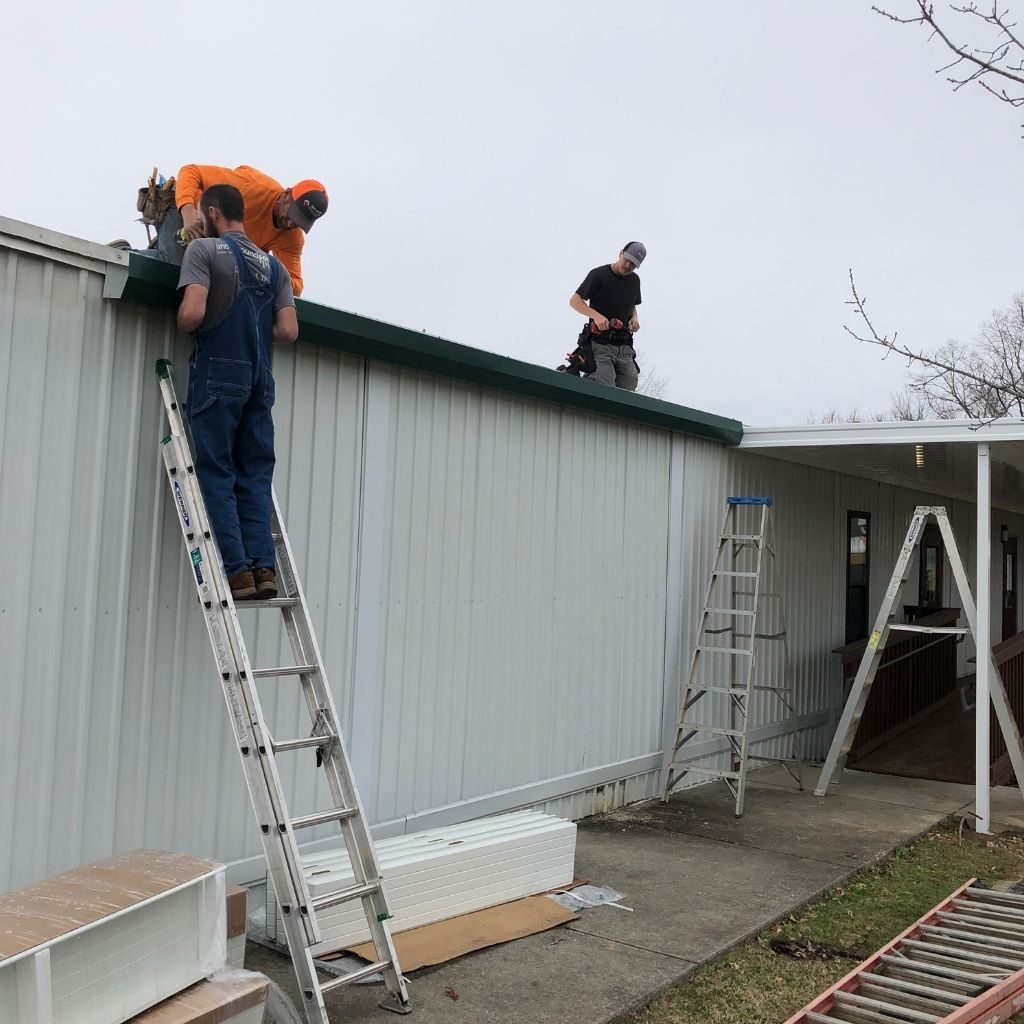 men installing gutters